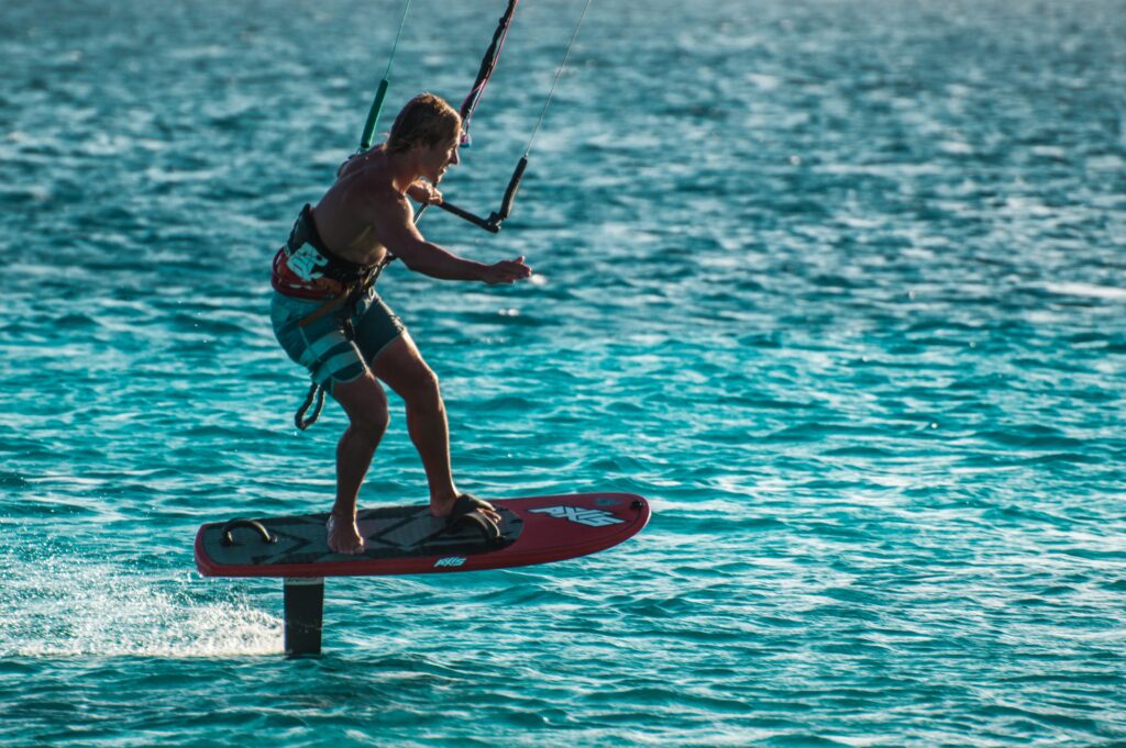 Man kite surfing in Bonaire Blue green water